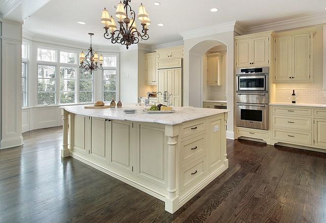 newly installed grey laminate floors in modern kitchen in Albertson NY